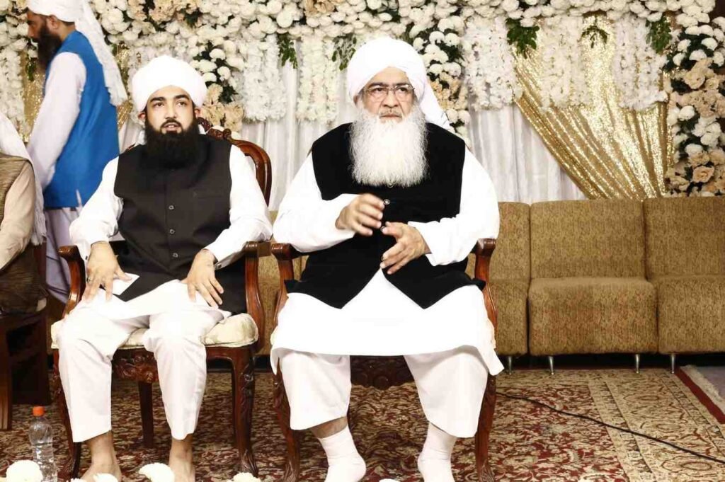 Shaykh Muhammad Mohsin Munawar Yousafi seated next to Shaykh Muhammad Bin Mohsin Mohsini in a formal portrait, highlighting the spiritual and scholarly lineage (silsilah).